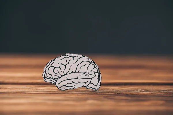 Paper with brain as dementia symbol on black background — Stock Photo