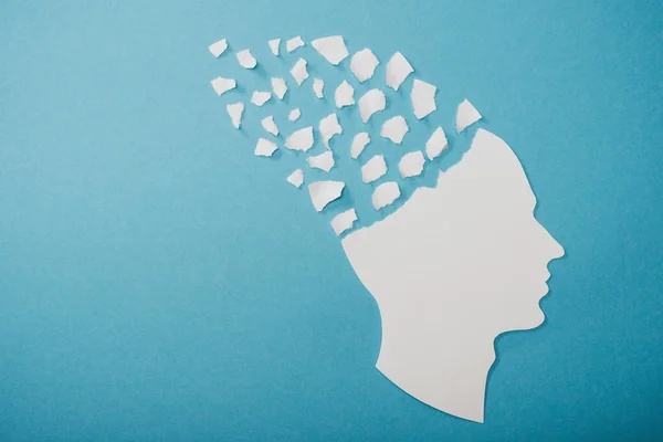Dementia symbol presented as face isolated on blue — Stock Photo