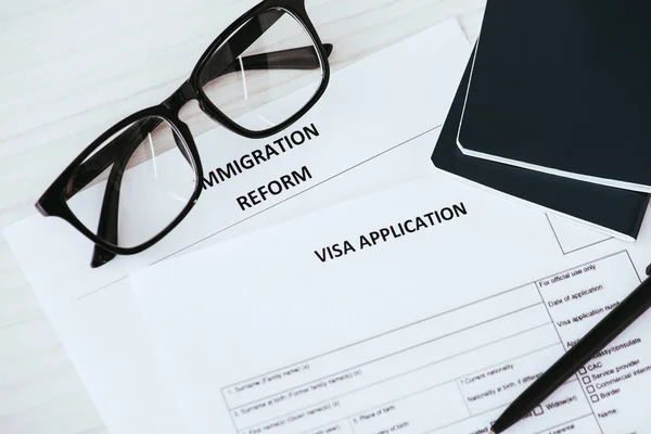 Documents with lettering near glasses and passports — Stock Photo