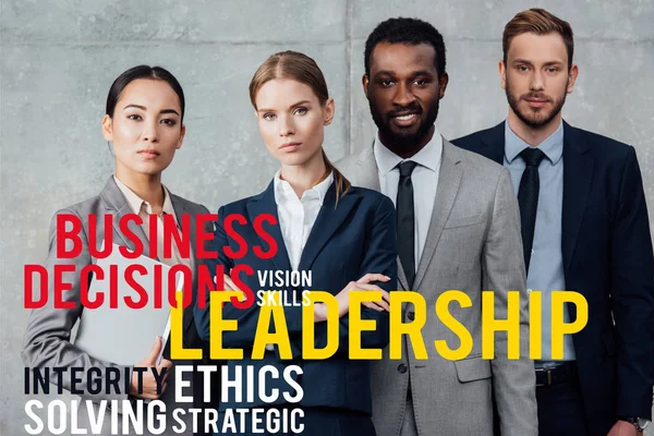 Focused multiethnic group of businesspeople in formal wear posing and looking at camera with leadership illustration in front — Stock Photo