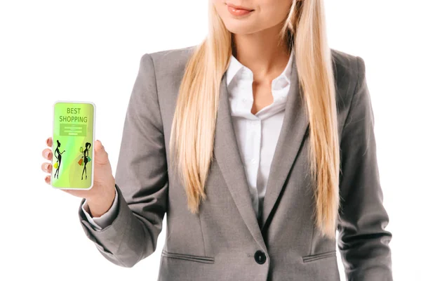 Vista recortada de la mujer de negocios que muestra el teléfono inteligente con la mejor aplicación de compras, aislado en blanco - foto de stock