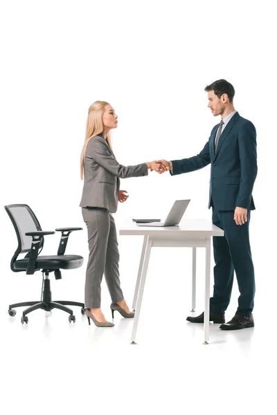 Businesspeople having deal at workplace with laptop, isolated on white — Stock Photo