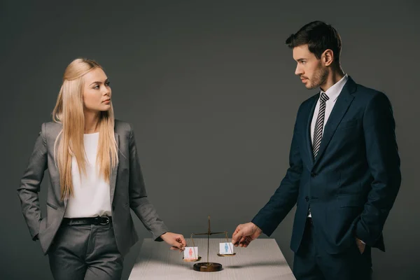 Business colleagues with male and female signs on scales of justice, gender equality concept — Stock Photo