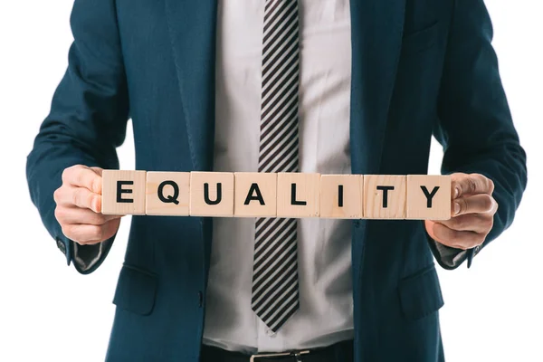 Cropped view of businessman holding alphabet cubes with equality word, isolated on white — Stock Photo