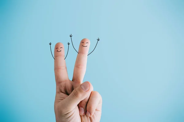 Cropped view of joyful human fingers isolated on blue — Stock Photo