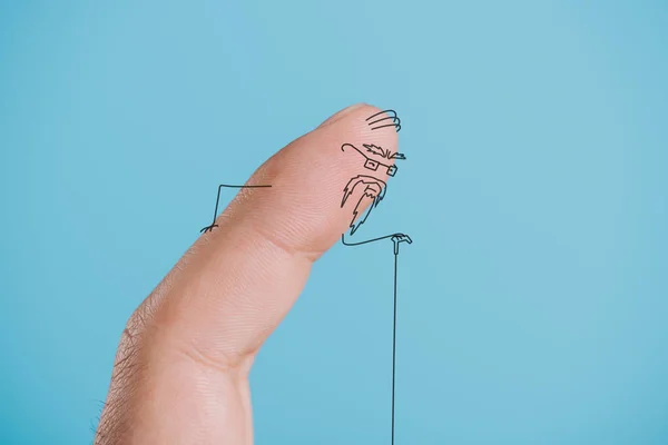 Cropped view of one finger as senior person isolated on blue — Stock Photo