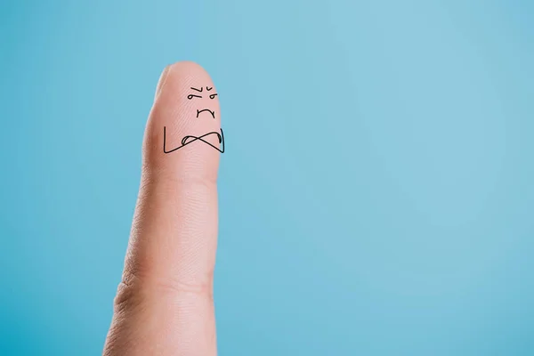 Cropped view of one dissatisfied finger isolated on blue — Stock Photo