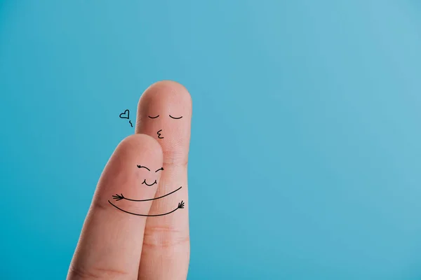 Cropped view of happy couple of fingers hugging isolated on blue — Stock Photo