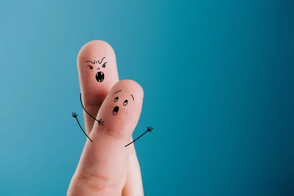 Cropped view of scared finger and vampire isolated on blue — Stock Photo