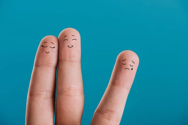 Cropped view of fingers as happy couple in love and third wheel isolated on blue — Stock Photo