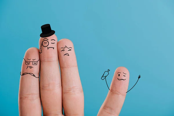 Cropped view of fingers as snobs looking at drunk man isolated on blue — Stock Photo
