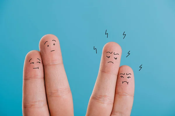 Cropped view of fingers as confused and angry couples isolated on blue — Stock Photo