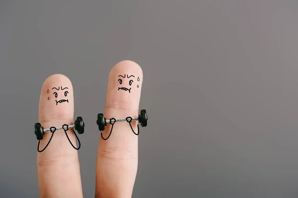 Cropped view of fingers as sportsmen training with barbells isolated on grey — Stock Photo