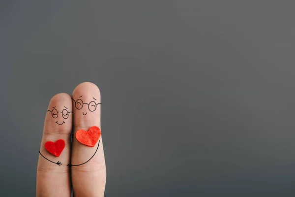 Cropped view of happy couple of fingers with hearts hugging isolated on grey, valentines day concept — Stock Photo