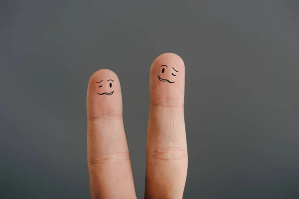 Cropped view of confused human fingers isolated on grey — Stock Photo