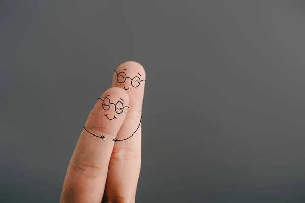 Partial view of smiling couple of fingers hugging isolated on grey — Stock Photo