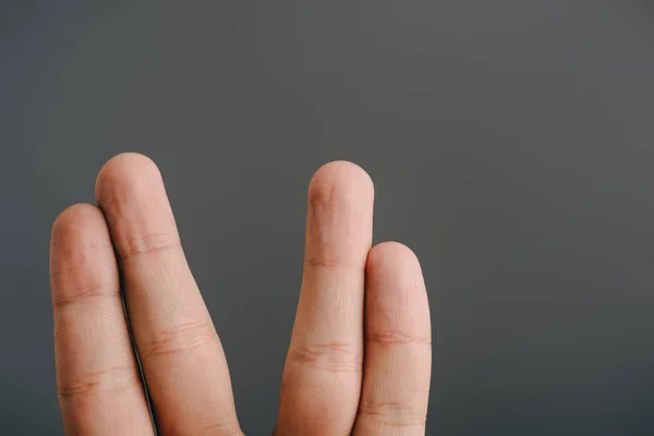 Cropped view of human fingers isolated on grey — Stock Photo