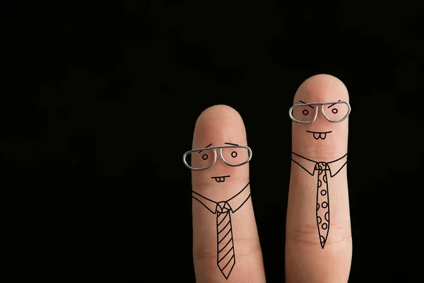 Cropped view of fingers as angry businessmen in ties and glasses isolated on black — Stock Photo