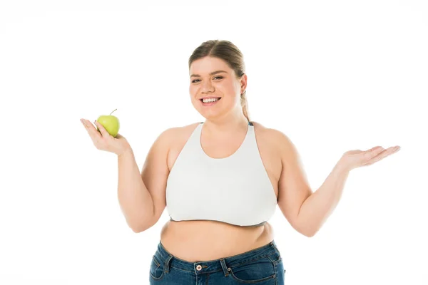 Happy smiling overweight woman holding green apple isolated on white — Stock Photo