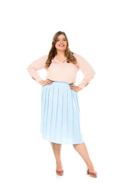 Smiling happy overweight woman in elegant clothing posing with hands on hips isolated on white — Stock Photo