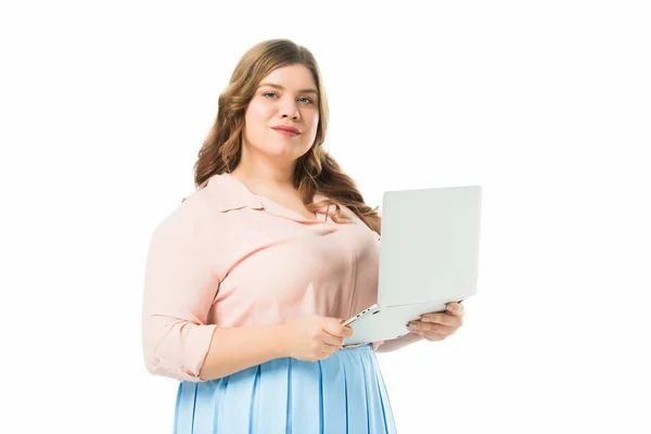 Attractive smiling plus size girl using laptop isolated on white — Stock Photo
