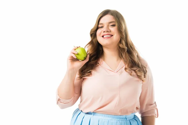 Happy overweight woman holding green apple isolated on white — Stock Photo