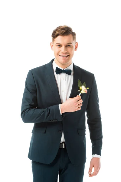 Happy handsome groom in black suit looking at camera isolated on white — Stock Photo