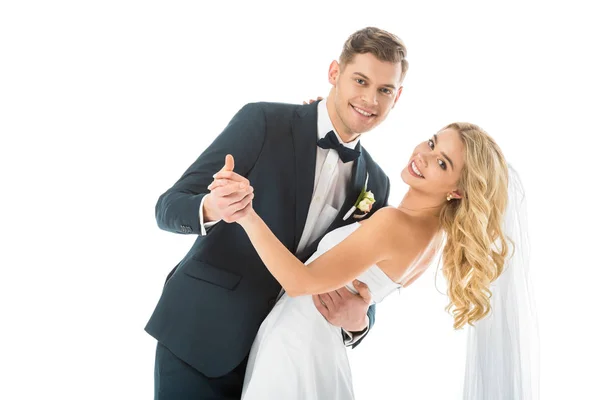 Feliz casal dançando e olhando para a câmera isolada no branco — Fotografia de Stock