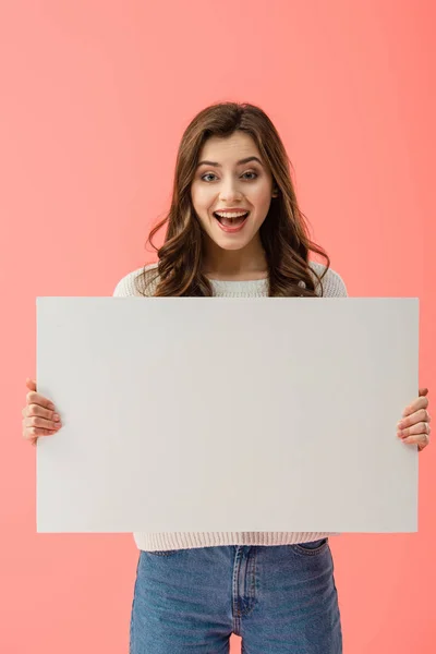 Happy and beautiful woman holding empty board with copy space isolated on pink — Stock Photo