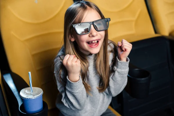 Excited emotional child in 3d glasses watching movie in cinema — Stock Photo