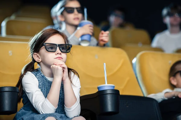 Selective focus of cute child in 3d glasses watching movie together with friends — Stock Photo