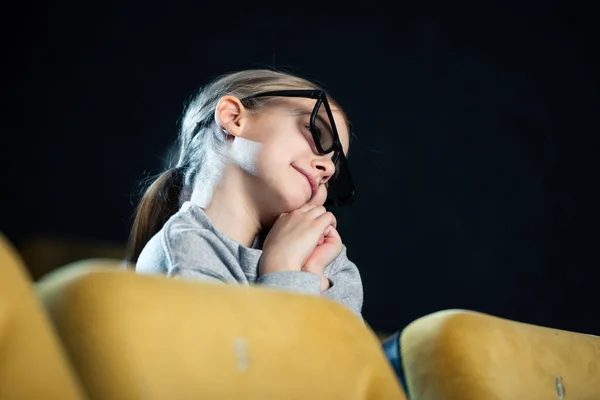 Cute dreamy child in 3d glasses watching movie in cinema — Stock Photo