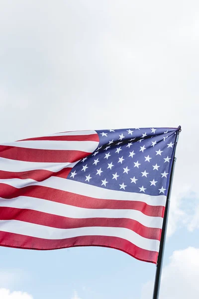 National flag of america with stars and stripes against sky — Stock Photo