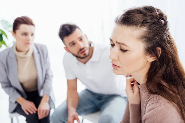 Selective focus of worried woman during group therapy session — Stock Photo