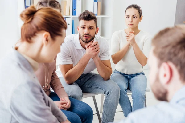 People sitting on chairs and having group therapy meeting — Stock Photo