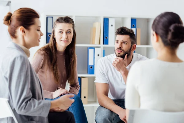 Group of people sitting and talking during therapy meeting — Stock Photo