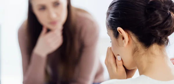 Panoramic shot of woman crying during therapy session with copy space — Stock Photo