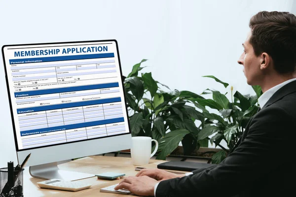 Man in suit filling in Online Collage Application, Document Form Concept — Stock Photo