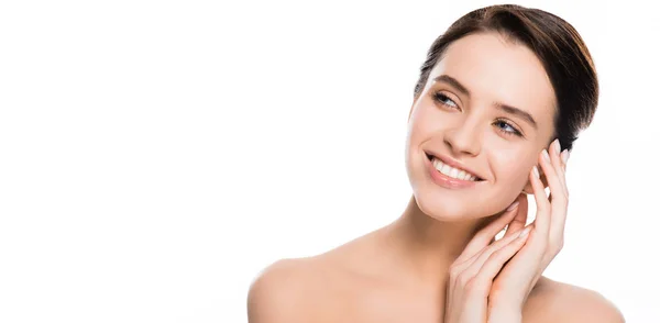 Panoramic shot of happy young woman smiling while touching skin isolated on white — Stock Photo