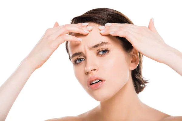 Attractive brunette woman touching forehead isolated on white — Stock Photo