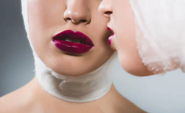 Cropped view of young woman with bandaged head near mirror on grey — Stock Photo