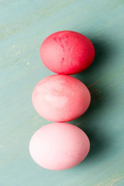 Top view of painted easter eggs on textured surface — Stock Photo