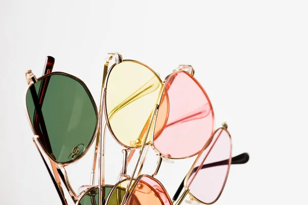 Top view of stylish colorful sunglasses on white — Stock Photo