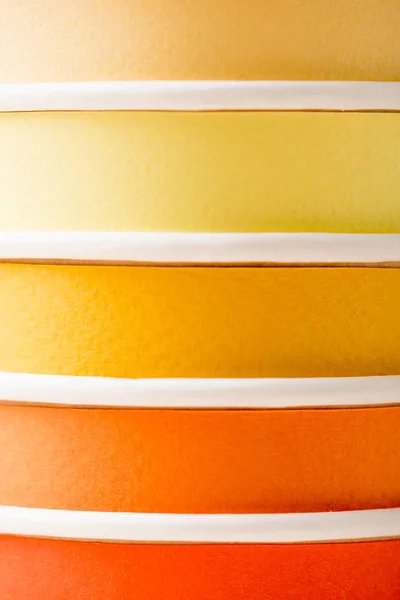 Close up view of bright colorful disposable cups — Stock Photo