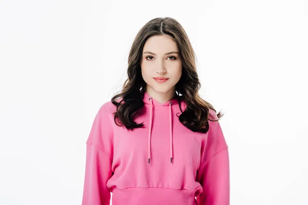 Attractive confident girl in pink hoodie looking at camera isolated on white — Stock Photo