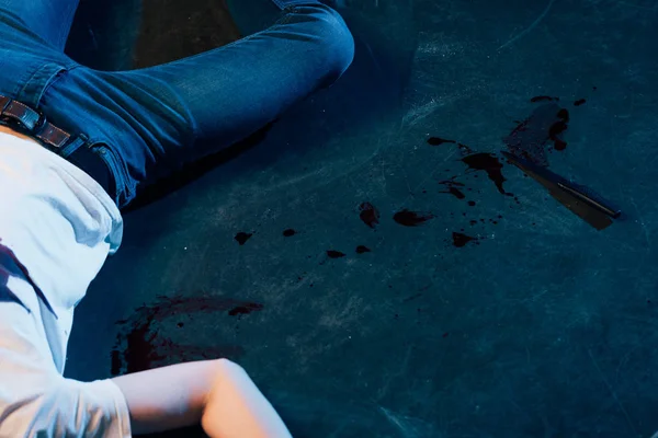 Partial view of dead man on floor at crime scene — Stock Photo