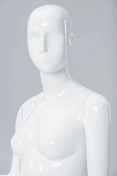 White plastic mannequin figure isolated on grey — Stock Photo