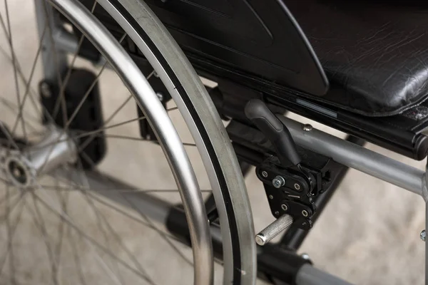 Selective focus of black wheelchair with leather seat — Stock Photo