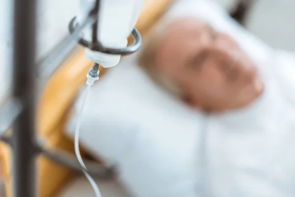 Selective focus of senior patient in coma in hospital — Stock Photo