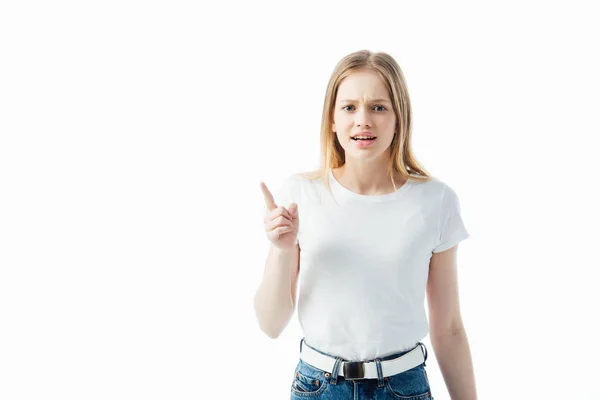 Angry upset teenage girl pointing with finger isolated on white — Stock Photo